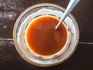 Hot tea in the glass on the table