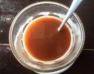 Hot tea in the glass on the table