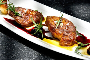 Foie gras grilled served with red berries sauce and chestnut.