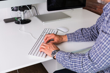 Senior man working in the office