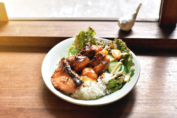 Braised belly pork and charcoal grilled salmon with rice.