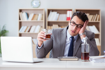 Businessman drinking in the office