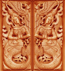  Traditional Old wood carving on the wall of Temple in Thailand,  Thai style