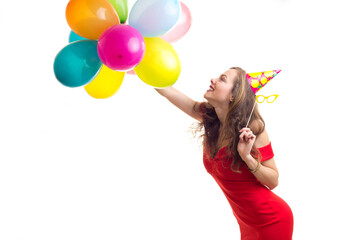 Fototapeta na wymiar Young woman holding balloons