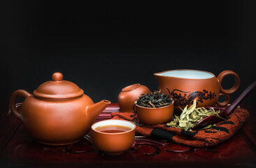 Chinese teapot set on black background