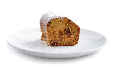 Piece of cake with raisin on the white plate