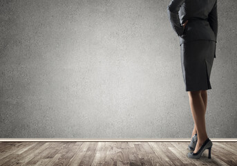 Businesswoman looking at wall