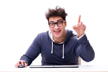 Funny nerd man working on computer isolated on white
