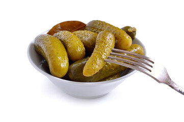 Marinaded cucumber on the white plate. Isolated