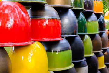 Closeup colorful ceramic vase arranged in layers