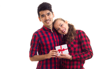 Young couple holding a present 