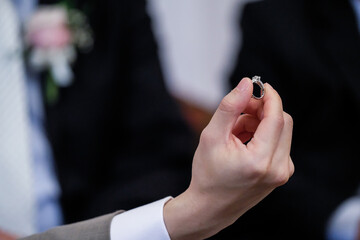 Diamonds  ring in hand groom  for wedding