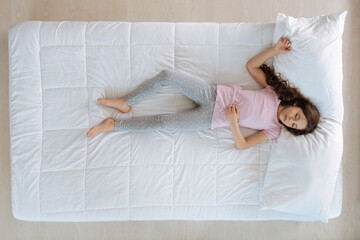 Beautiful nice girl lying on the bed