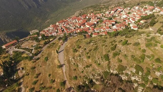 Aerial drone video of arcaheological site of Delphi, temple of Apollo, Greece