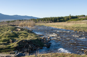 A mountain river flows next to the village