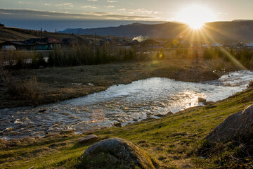 A mountain river flows next to the village