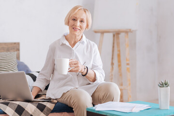 Magnificent retirement worker smiling on camera