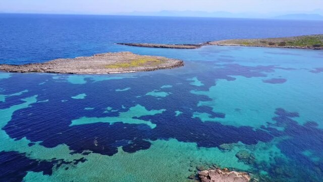 Aerial drone video of seascape in Hamolia with turquoise waters, Porto Rafti, Mesogeia, Attica, Greece