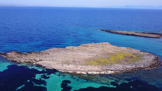 Aerial drone video of seascape in Hamolia with turquoise waters, Porto Rafti, Mesogeia, Attica, Greece