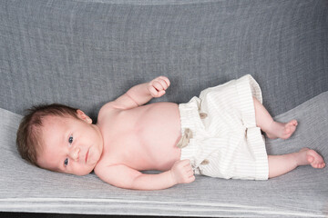 A newborn baby lying torso
