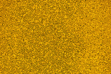 Bright golden artificial scales and glitter in small combs abstract background
