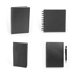 Set of black closed notebooks with pen on white.