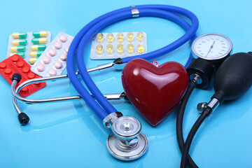 RX prescription, Red heart, asorted pils and a stethoscope on white background