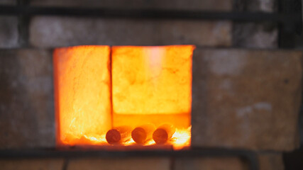 Forging a fire for heating metal in forge oven