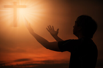 Christian man praying worship at sunset. Hands folded in prayer. worship god with christian concept religion.