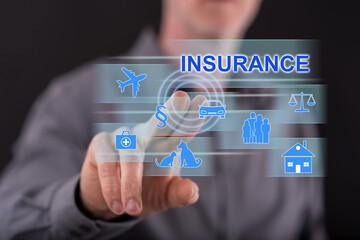 Man touching an insurance concept on a touch screen