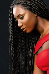 Beautiful young african woman with long braided hair. - obrazy, fototapety, plakaty