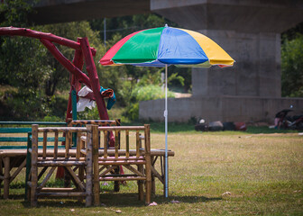 colorful umbrella with bench