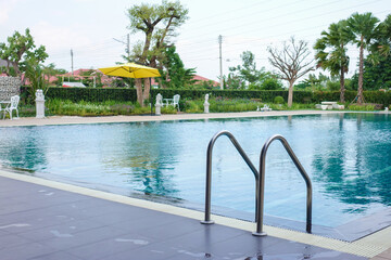 Swimming pool with stair at hotel,Swimming pool of luxury hotel