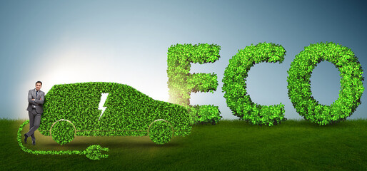 Businessman in green electric car concept
