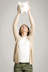 Woman holding piggybank