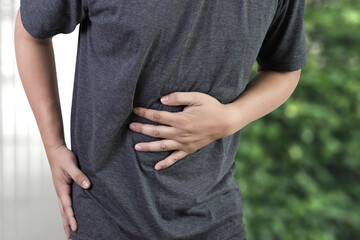 Businessman stomachache attack of bacteria