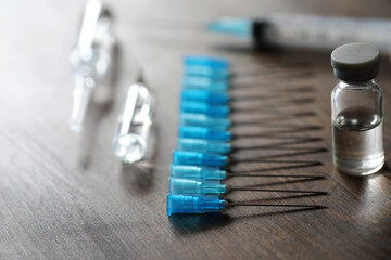 Ampoule and needles from a medical syringe