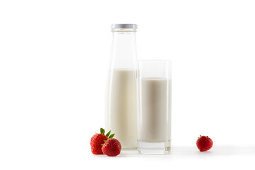 milk in bottle and glass with fresh strawberries isolated on white
