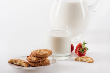 homemade cookies with fresh milk and strawberries isolated on white