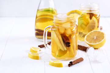 Infused water Fresh homemade ice tea with apple citrus and cinnamon