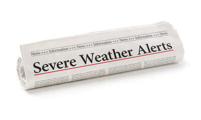 Rolled newspaper with the headline Severe Weather Alerts