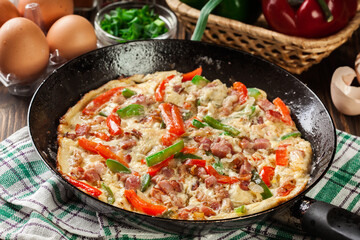 Fresh omelette with bacon and bell pepper