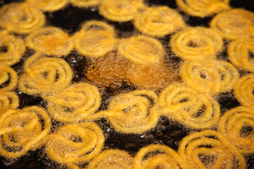Delicious jalebi frying in oil pan