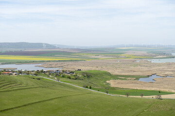 Fototapeta na wymiar Beautiful panorama from Enisala Medieval Fortress also referred as Heracleea Fortress with Razim lake in the background, Tulcea county, Dobrogea region, Romania, in a sunny spring day 
