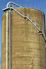 Painted concrete cylindrical industrial silos in former industrial zone of Auckland transformed into recreational one.