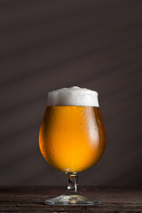 Glass of unfiltered light beer