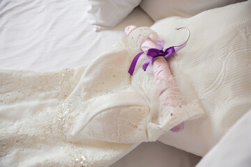 Obraz na płótnie Canvas Wedding dress for bride on bed, white bridal gown