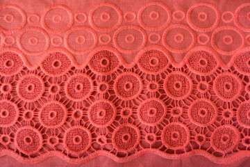 Coral red linen fabric with embroidered circles and crochet lace