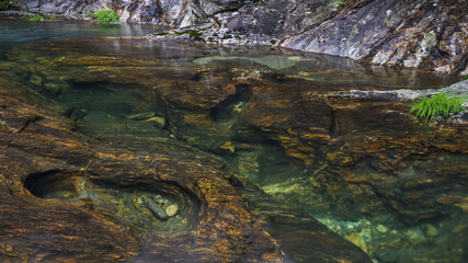 River with waterfall in the middle of the mountain
