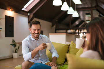 Couple having coffee and conversation in morning.